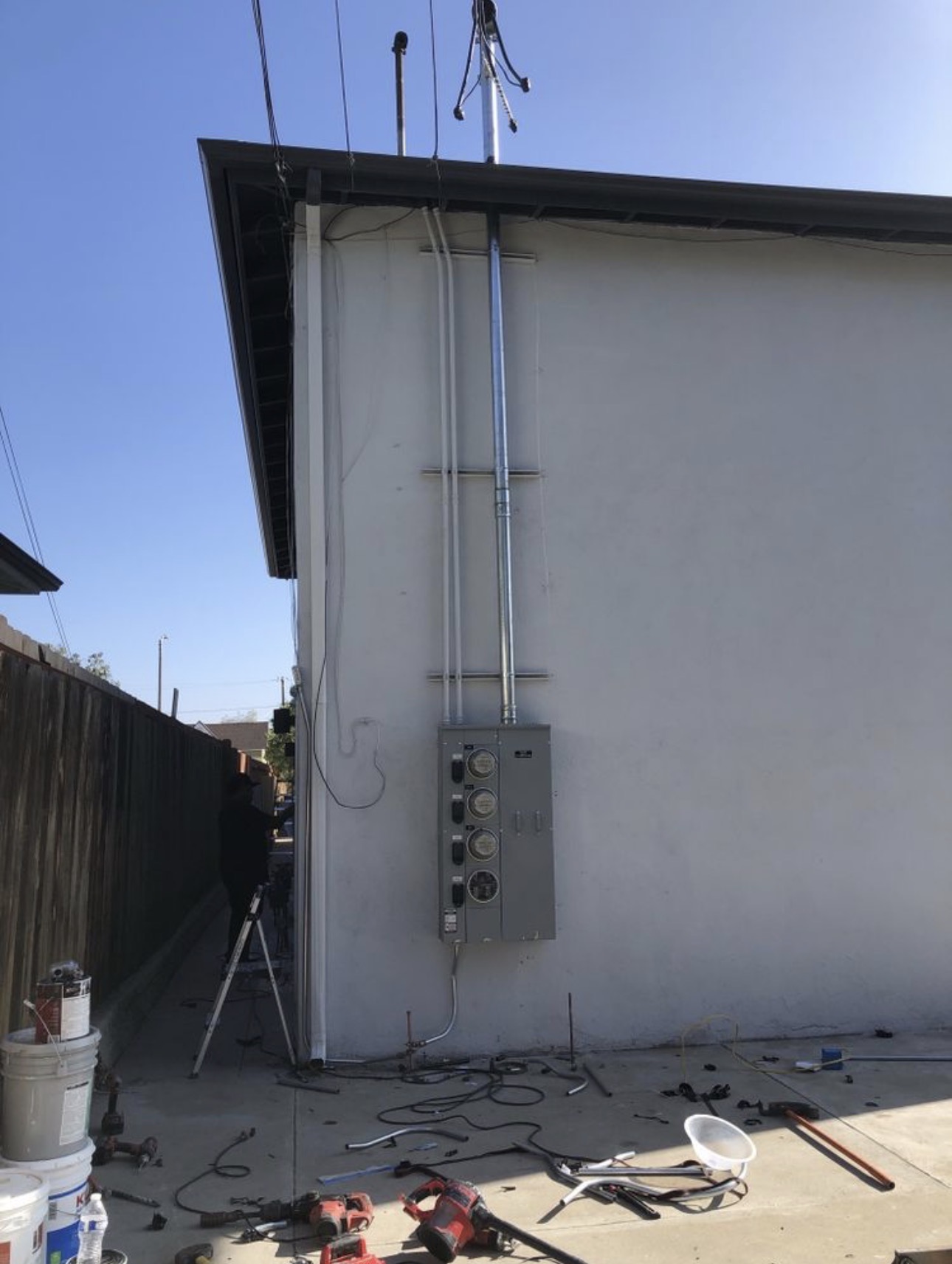New service mast and multi-meter panel on an apartment building